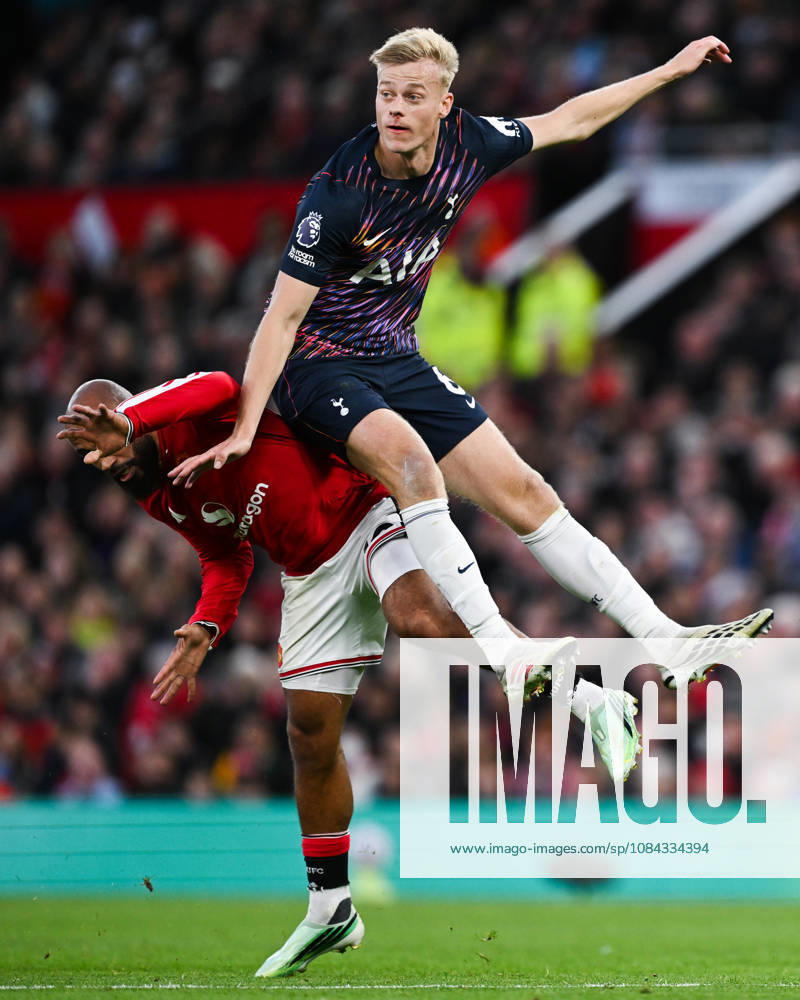 MANCHESTER, ENGLAND, OCT 10: Bryan Mbeumo of Manchester United, ManU is challenged by Jan Paul van Hecke of Tottenham Hotspur during the Premier League match between Manchester United and Tottenham Hotspur at Old Trafford in Manchester, England (Will Palmer Sports Press Photo)
