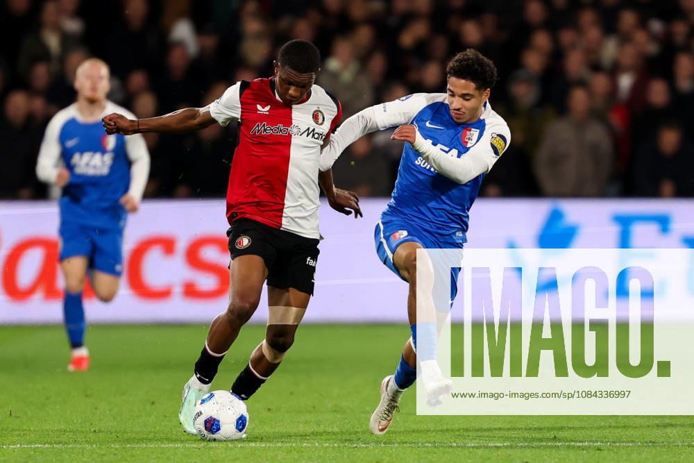 2026-10-10 Feyenoord v AZ Alkmaar - Dutch Eredivisie ROTTERDAM, NETHERLANDS - OCTOBER 10: Givairo Read of Feyenoord is challenged by Ro-Zangelo Daal of AZ Alkmaar during the Dutch Eredivisie match between Feyenoord and AZ Alkmaar at Stadion Feijenoord on October 10, 2026 in Rotterdam, Netherlands. Rotterdam Stadion Feijenoord Netherlands Content not available for redistribution in The Netherlands directly or indirectly through any third parties.