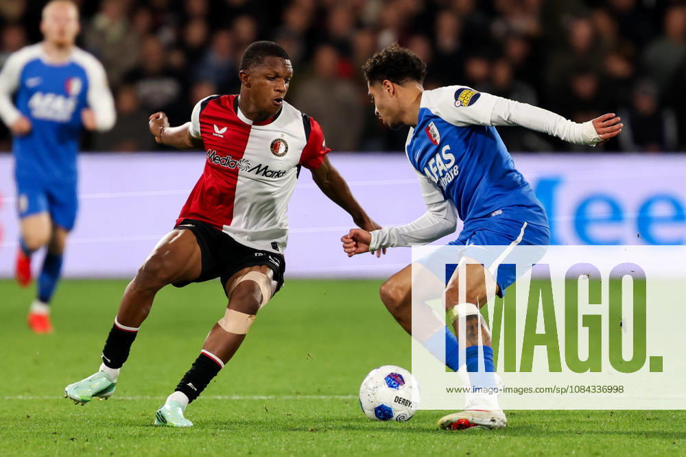2026-10-10 Feyenoord v AZ Alkmaar - Dutch Eredivisie ROTTERDAM, NETHERLANDS - OCTOBER 10: Givairo Read of Feyenoord is challenged by Ro-Zangelo Daal of AZ Alkmaar during the Dutch Eredivisie match between Feyenoord and AZ Alkmaar at Stadion Feijenoord on October 10, 2026 in Rotterdam, Netherlands. Rotterdam Stadion Feijenoord Netherlands Content not available for redistribution in The Netherlands directly or indirectly through any third parties.