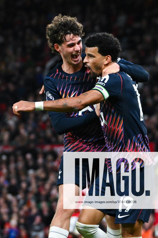 MANCHESTER, ENGLAND, OCT 10: Dominic Solanke of Tottenham Hotspur celebrates with teammate Archie Gray after scoring his sides first goal during the Premier League match between Manchester United, ManU and Tottenham Hotspur at Old Trafford in Manchester, England (Will Palmer Sports Press Photo)