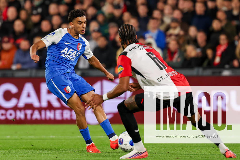 2026-10-10 Feyenoord v AZ Alkmaar - Dutch Eredivisie ROTTERDAM, NETHERLANDS - OCTOBER 10: Ayoub Oufkir of AZ Alkmaar is challenged by Jeremiah St. Juste of Feyenoord during the Dutch Eredivisie match between Feyenoord and AZ Alkmaar at Stadion Feijenoord on October 10, 2026 in Rotterdam, Netherlands. Rotterdam Stadion Feijenoord Netherlands Content not available for redistribution in The Netherlands directly or indirectly through any third parties.