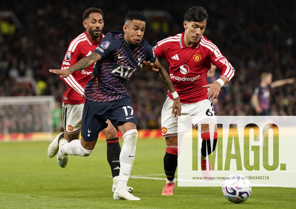 Manchester, England, 10th October 2026. Savio of Tottenham Hotspur (L) is challenged by Lisandro Martinez of Manchester United, ManU during the Manchester United vs Tottenham Hotspur Premier League match at Old Trafford, Manchester. Picture credit should read: Andrew Yates Sportimage . SPI_055_AY_MANUTD_SPURS SPI-5058-0055