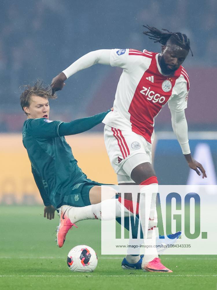 , JohanCruyff Arena , season 2026 2027 , Dutch Eredivisie football , Match between Ajax and NEC Nijmegen , picture shows NEC Nijmegen player Perr Schuurs challenges Ajax player Tolu Arokodare Ajax - NEC x208125190x