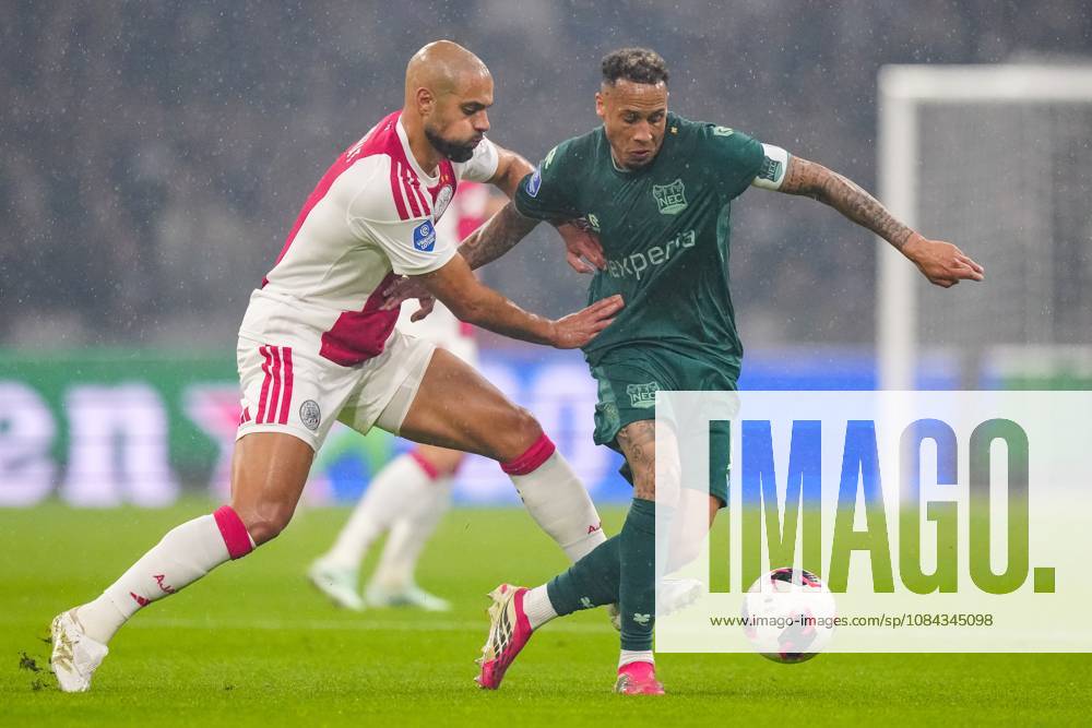 , JohanCruyff Arena , season 2026 2027 , Dutch Eredivisie football , Match between Ajax and NEC Nijmegen , picture shows Ajax player Sofyan Amrabat challenges NEC Nijmegen player Tjaronn Chery Ajax - NEC x208125419x