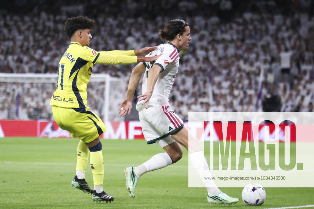 Real Madrid v Villarreal - La Liga EA Sports 2026 27 October 10, 2026, Estadio Santiago Bernabeu, Madrid, Spain: Alvaro Carreras of Real Madrid protects the ball against Ilias Akhomach of Villarreal during La Liga EA Sports match between Real Madrid and Villarreal at Estadio Santiago Bernabeu on October 10, 2026 in Madrid, Spain. Madrid Estadio Santiago Bernabeu Madrid Spain