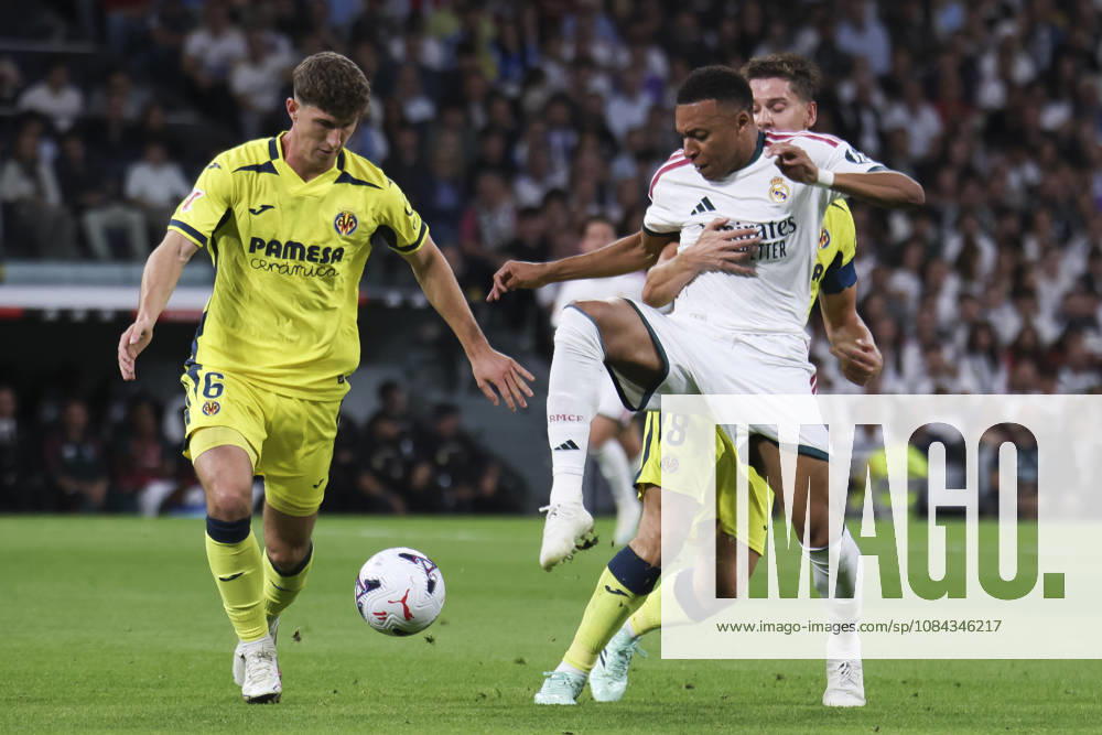 Real Madrid v Villarreal - La Liga EA Sports 2026 27 October 10, 2026, Estadio Santiago Bernabeu, Madrid, Spain: Kylian Mbappe of Real Madrid is defended by Navarro Pau and Juan Foyth of Villarreal during La Liga EA Sports match between Real Madrid and Villarreal at Estadio Santiago Bernabeu on October 10, 2026 in Madrid, Spain. Madrid Estadio Santiago Bernabeu Madrid Spain