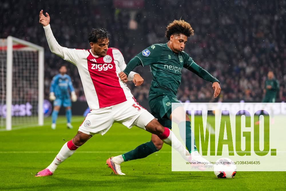 , JohanCruyff Arena , season 2026 2027 , Dutch Eredivisie football , Match between Ajax and NEC Nijmegen , picture shows Ajax player Owen Wijndal and NEC Nijmegen player Noe Lebreton battle for the ball Ajax - NEC x208126672x