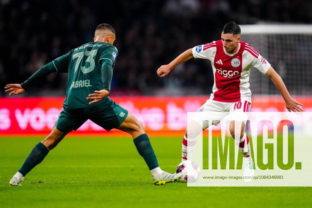 , JohanCruyff Arena , season 2026 2027 , Dutch Eredivisie football , Match between Ajax and NEC Nijmegen , picture shows NEC Nijmegen player Gabriel Bras challenges Ajax player Oscar Gloukh Ajax - NEC x208127035x