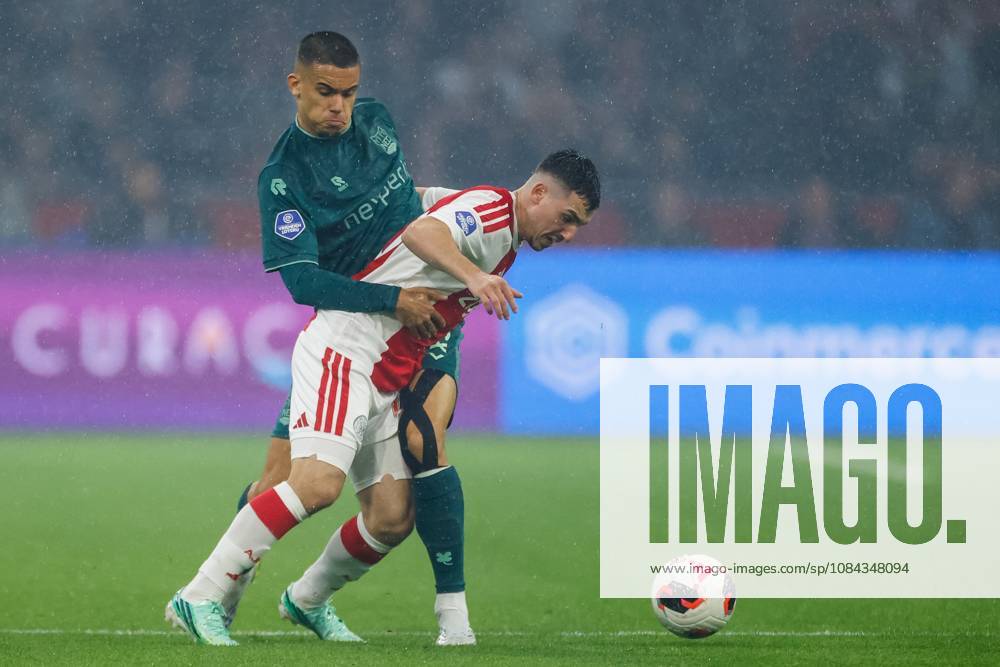 , JohanCruyff Arena , season 2026 2027 , Dutch Eredivisie football , Match between Ajax and NEC Nijmegen , picture shows NEC Nijmegen player Gabriel Bras challenges Ajax player Oscar Gloukh Ajax - NEC x208128111x