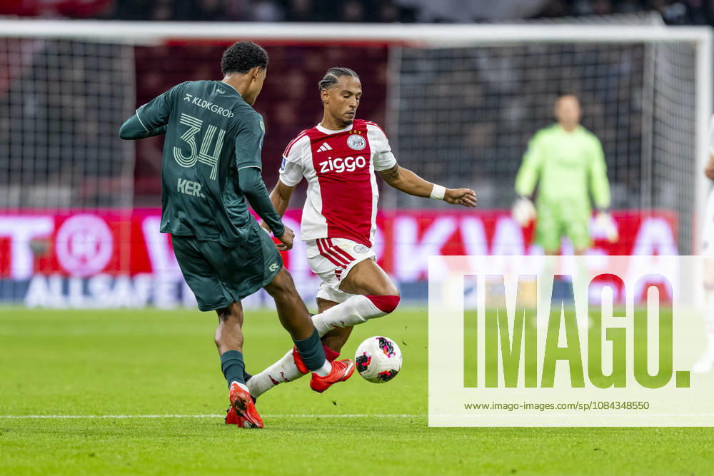 AMSTERDAM - (l-r) N.E.C. Nijmegen defender Kevin Kers and AFC Ajax Amsterdam midfielder Thilo Kehrer during the Vriendenloterij Eredivisie match between Ajax and N.E.C. in Johan Cruijff ArenA on 10 October 2026 in Amsterdam, Nederland. (Photo by DeFodi Images) -