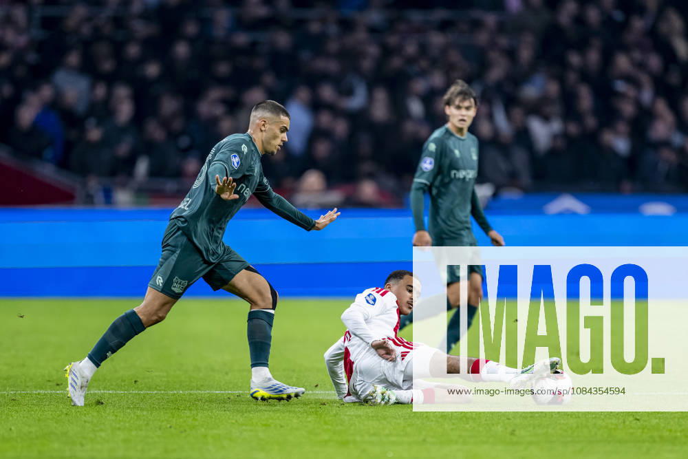 AMSTERDAM - (l-r) N.E.C. Nijmegen defender Gabriel Bras and AFC Ajax Amsterdam midfielder Abdellah Ouazane during the Vriendenloterij Eredivisie match between Ajax and N.E.C. in Johan Cruijff ArenA on 10 October 2026 in Amsterdam, Netherlands. (Photo by DeFodi Images) -