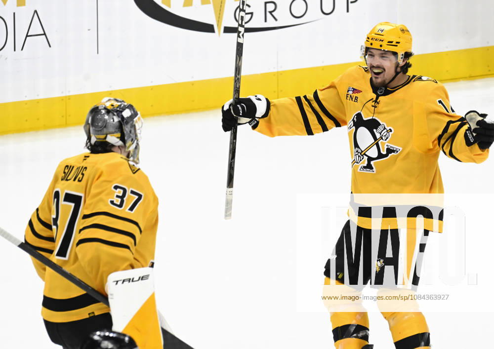 Pittsburgh Penguins left wing Nick Robertson (14) skates in to celebrates the 2-1 shootout win against the Dallas Stars with Pittsburgh Penguins goaltender Arturs Silovs (37) at PPG Paints Arena in Pittsburgh on Saturday, October, 10 2026. PIT2026101011 ARCHIExCARPENTER
