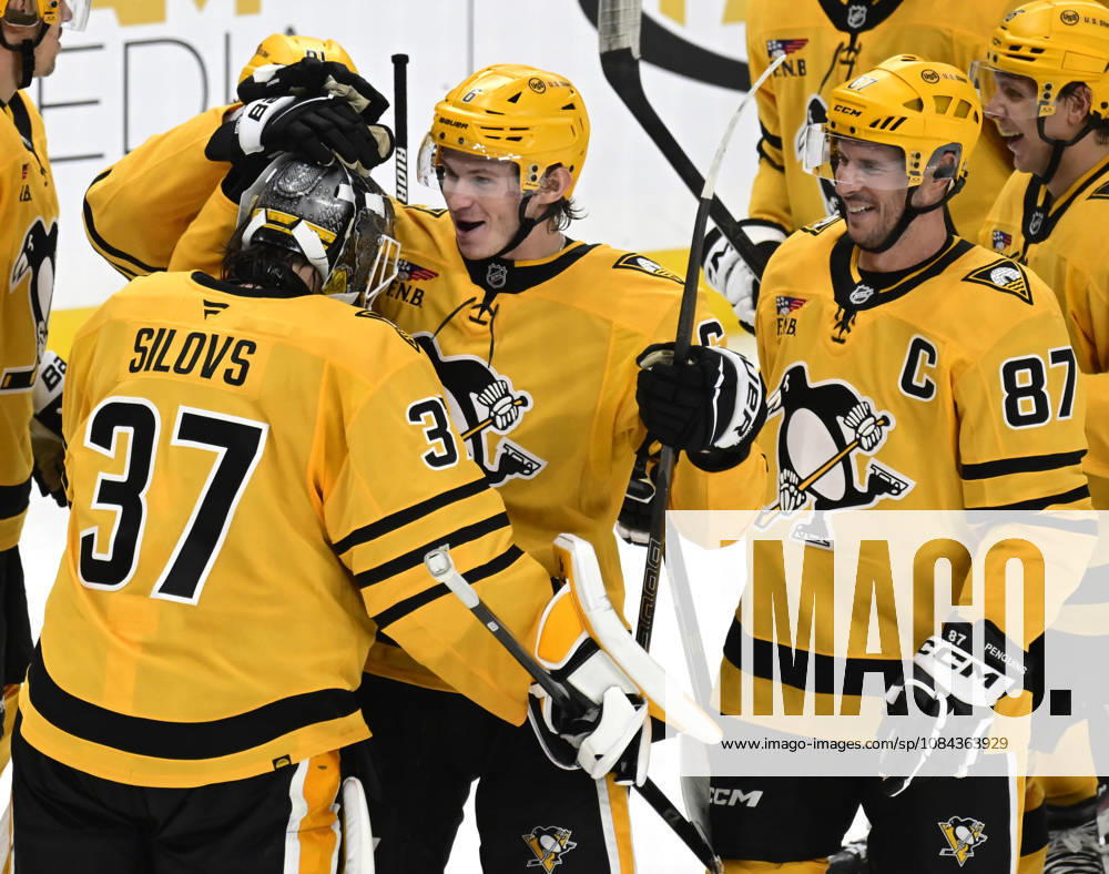 Pittsburgh Penguins defenseman Kaedan Korczak (6) and Pittsburgh Penguins center Sidney Crosby (87) celebrates the overtime shootout victory with Pittsburgh Penguins goaltender Arturs Silovs (37) following the 2-1 win at PPG Paints Arena in Pittsburgh on Saturday, October, 10 2026. PIT2026101013 ARCHIExCARPENTER