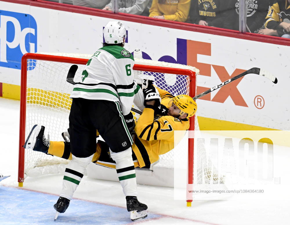 Dallas Stars defenseman Lian Bichsel (6) receives an interference penalty as he pushes Pittsburgh Penguins right wing Bryan Rust (17) into the goal during the third period at PPG Paints Arena in Pittsburgh on Saturday, October, 10 2026. The Pittsburgh Penguins went on to win 2-1 in a shootout. PIT2026101021 ARCHIExCARPENTER