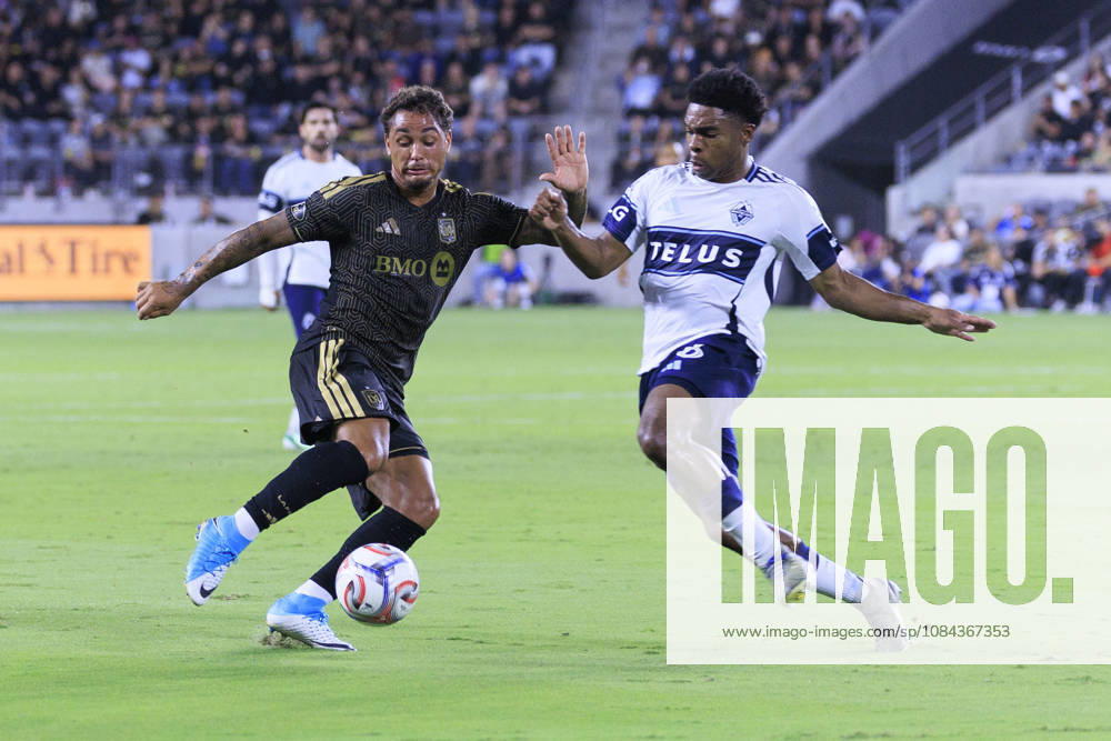 Armindo Sieb 9 of the Los Angeles Football Club and Ralph Priso-Mbongue 6 of the Vancouver Whitecaps struggle for possession of the ball during their regular season MLS, Fussball Herren, USA game on Saturday October 10, 2026 at the BMO Stadium in Los Angeles, California. LAFC tie with Whitecaps, 1-1. ARIANA RUIZ PI Los Angeles USA - ZUMAp124 20261010_zaa_p124_014