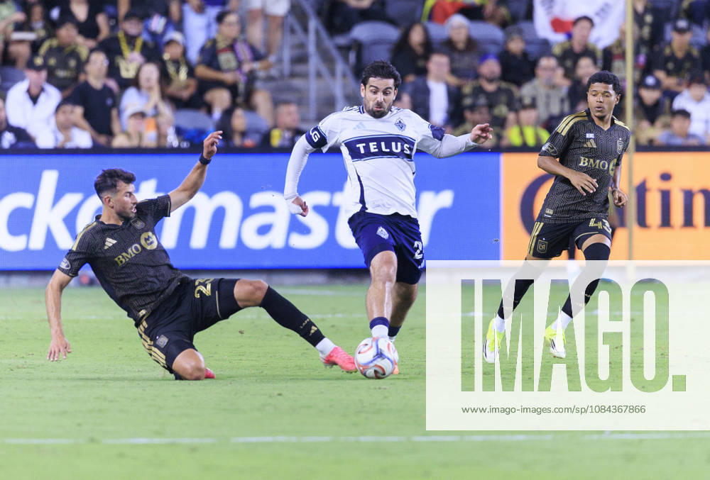 Yevhen Cheberko 24 of the Los Angeles Football Club slide tackles Brian White 24 of the Vancouver Whitecaps during their regular season MLS, Fussball Herren, USA game on Saturday October 10, 2026 at the BMO Stadium in Los Angeles, California. LAFC tie with Whitecaps, 1-1. ARIANA RUIZ PI Los Angeles USA - ZUMAp124 20261010_zaa_p124_022