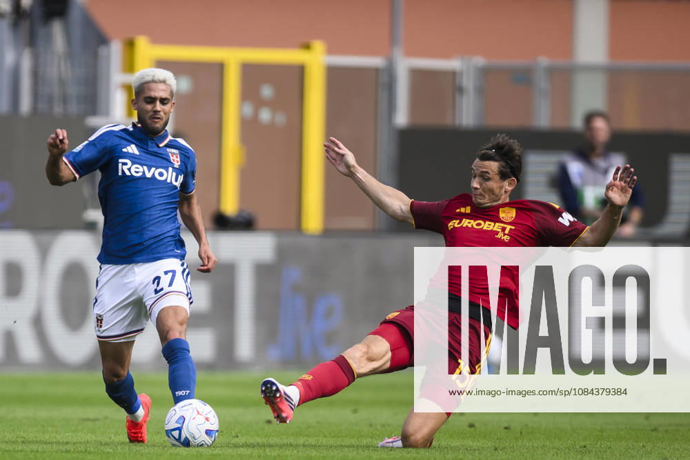 Como 1907 v AS Roma - Serie A Yan Couto of Como 1907 is tackled by Marten de Roon of AS Roma during the Serie A football match between Como 1907 and AS Roma. Como Italy