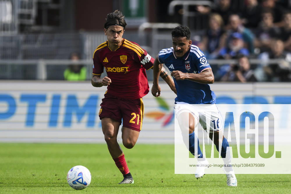 Como 1907 v AS Roma - Serie A Kaiki Bruno of Como 1907 competes for the ball with Paulo Dybala of AS Roma during the Serie A football match between Como 1907 and AS Roma. Como Italy