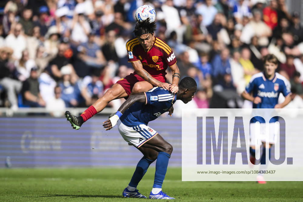 Como 1907 v AS Roma - Serie A Paulo Dybala of AS Roma competes for a header with Trevoh Chalobah of Como 1907 during the Serie A football match between Como 1907 and AS Roma. Como Italy