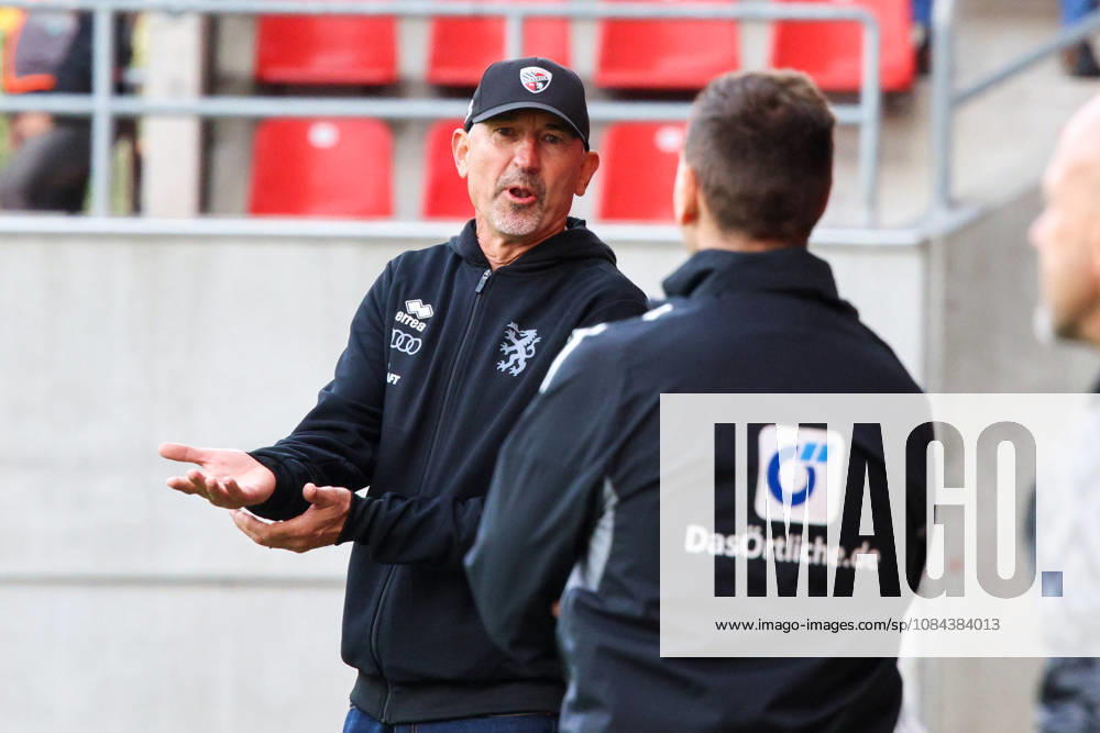 Trainer Achim Beierlorzer (Cheftrainer FC Ingolstadt 04) diskutiert erstmal mit dem 4. Unparteiischen beim Spiel FC Ingolstadt 04 gegen SV Wehen Wiesbaden am 11.10.2026, DFB regulations prohibit any use of photographs as image sequences and or quasi-video. GER, Fussball, 3. Liga, Spieltag 8, FC Ingolstadt 04 gegen SV Wehen Wiesbaden, 11.10.2026, Audi Sportpark Ingolstadt