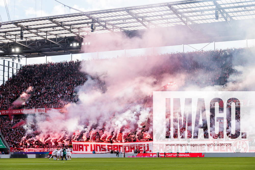 Tifo of 1. FC Koeln fans while burning pyrotechnics bengalos during the Bundesliga match between 1. FC Koeln vs. Borussia Moenchengladbach at Rheinenergie-Stadion on matchday 5 of the 1. Bundesliga on October 11, 2026 in Koeln, Germany. DFL REGULATIONS PROHIBIT ANY USE OF PHOTOGRAPHS AS IMAGE SEQUENCES AND OR QUASI-VIDEO. Wat uns aandriev, brennt wie fueer What drives us, burns like fire. North Rhine Westphalia Germany