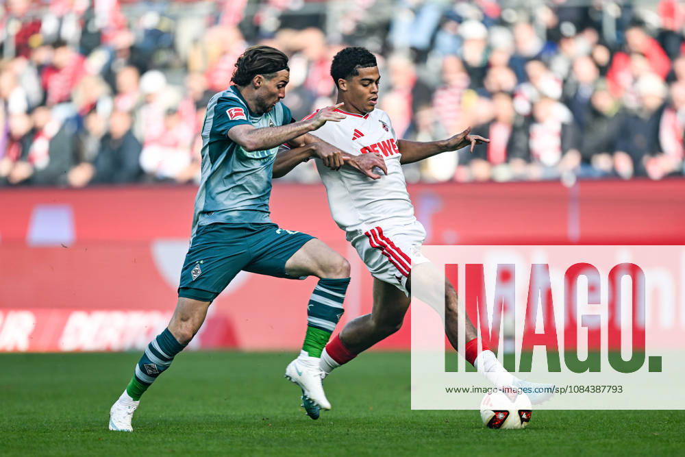 V. li. im Zweikampf Joe Scally (Moenchengladbach 29) Jahmai Simpson-Pusey (Koeln 22) 11.10.2026 ¢ Fussball ¢ 1. FC Koeln vs Borussia Moenchengladbach, RheinEnergieStadion, Koeln, DFB DFL REGULATIONS PROHIBIT ANY USE OF PHOTOGRAPHS AS IMAGE SEQUENCES AND OR QUASI-VIDEO NRW Germany