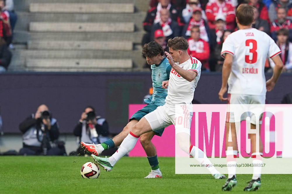 Herren, Fußball, 1.Bundesliga, 1.FC Köln - Borussia Mönchengladbach, Saison 2026 2027, RheinEnergieSTADION: Philipp Sander (Borussia Moenchengladbach, 16) im Zweikampf gegen Marius Buelter (1.FC Köln, 30) DFB regulations prohibit any use of photographs as image sequences and or quasi-video.