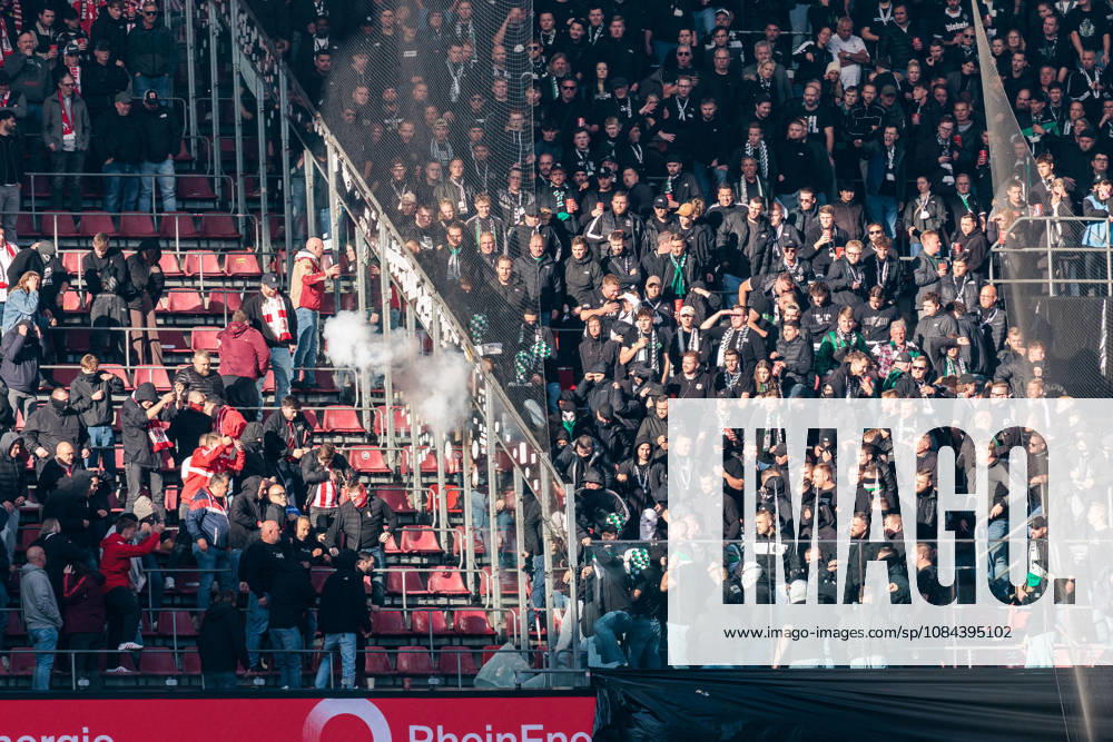 Fans of Borussia Moenchengladbach throwing pyrotechnics over into the 1. FC Koeln fans after breaking the security glass during the Bundesliga match between 1. FC Koeln vs. Borussia Moenchengladbach at Rheinenergie-Stadion on matchday 5 of the 1. Bundesliga on October 11, 2026 in Koeln, Germany. DFL REGULATIONS PROHIBIT ANY USE OF PHOTOGRAPHS AS IMAGE SEQUENCES AND OR QUASI-VIDEO. North Rhine Westphalia Germany