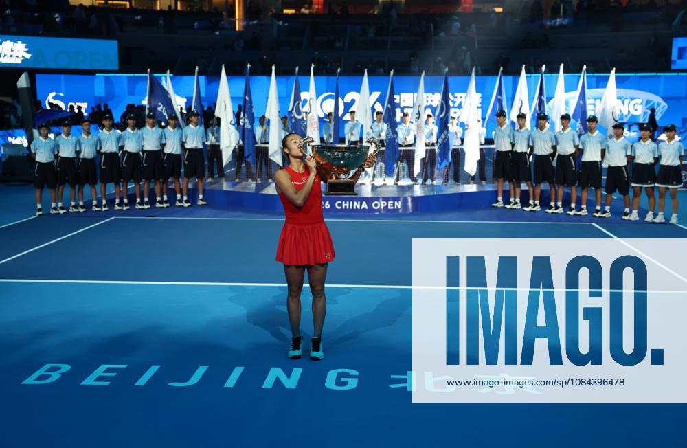 (261011) -- BEIJING, Oct. 11, 2026 -- Zheng Qinwen kisses the trophy during the awarding ceremony after the women s singles final between Zheng Qinwen of China and Mirra Andreeva of Russia at 2026 China Open tennis tournament in Beijing, China, Oct. 11, 2026. ) (SP)CHINA-BEIJING-TENNIS-CHINA OPEN-WOMEN S SINGLES-FINAL (CN) ZhangxChenlin