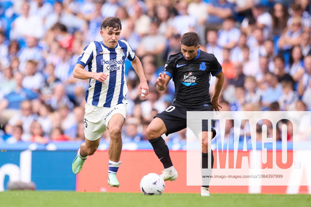 Pablo Marin of Real Sociedad competes for the ball with Yeremay Hernandez of RC Deportivo de A Coruna during the LaLiga EA Sports match between Real Sociedad and RC Deportivo de A Coruna at Anoeta on October 11, 2026, in San Sebastian, Spain. San Sebastian Spain - ZUMAa181 20261011_zaa_a181_114