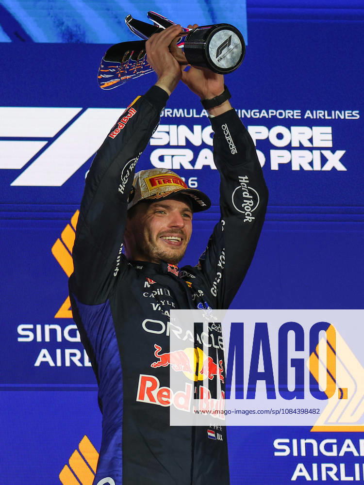 Max Verstappen wins 2026 Formula 1 Singapore Grand Prix SINGAPORE - OCT 11: Red Bull Racing driver Max Verstappen celebrates on the podium after winning the Formula 1 Singapore Grand Prix at the Marina Bay Street Circuit in Singapore on October 11, 2026. Daniel Ceng Anadolu Singapore Singapore. Editorial use only. Please get in touch for any other usage.