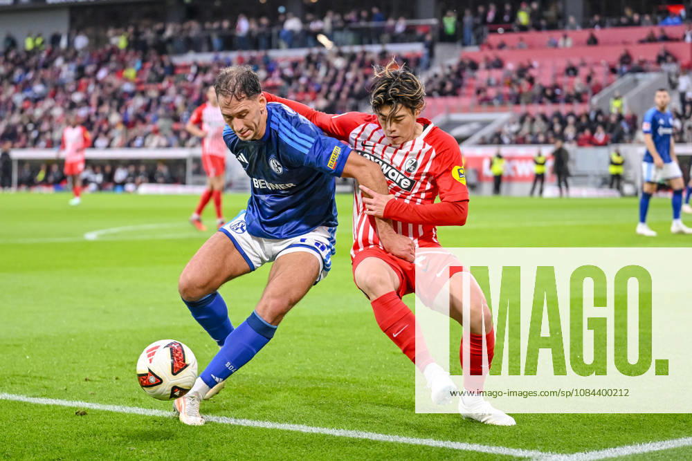Nikola Katić (FC Schalke 04) und Yuito Suzuki (SC Freiburg) im Zweikampf waehrend des spiels der 1. Bundesliga zwischen Club Freiburg und FC Schalke 04, Europa-Park Stadion am 11. October 2026 in Freiburg im Breisgau, Deutschland. (Foto von Harry Langer DeFodi Images) +++ Nikola Katić (FC Schalke 04) und Yuito Suzuki (SC Freiburg) battle for the ball during the Bundesliga match between Sport-Club Freiburg and FC Schalke 04 at Europa-Park Stadion on October 11, 2026 in Freiburg im Breisgau, Germany. (Photo by Harry Langer DeFodi Images) DFB DFL REGULATIONS PROHIBIT ANY USE OF PHOTOGRAPHS AS IMAGE SEQUENCES AND OR QUASI-VIDEO. (Photo by Harry Langer DeFodi Images) DFB DFL REGULATIONS PROHIBIT ANY USE OF PHOTOGRAPHS AS IMAGE SEQUENCES AND OR QUASI-VIDEO. -