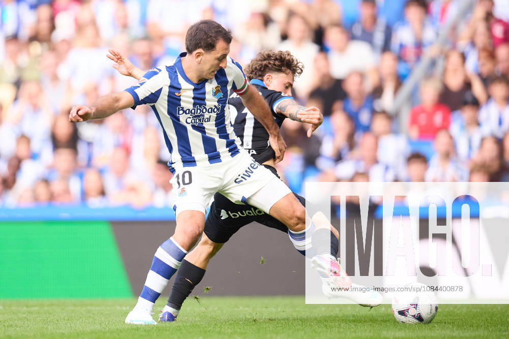 Mikel Oyarzabal of Real Sociedad competes for the ball with Mario Soriano of RC Deportivo de A Coruna during the LaLiga EA Sports match between Real Sociedad and RC Deportivo de A Coruna at Anoeta on October 11, 2026, in San Sebastian, Spain. San Sebastian Spain - ZUMAa181 20261011_zaa_a181_136