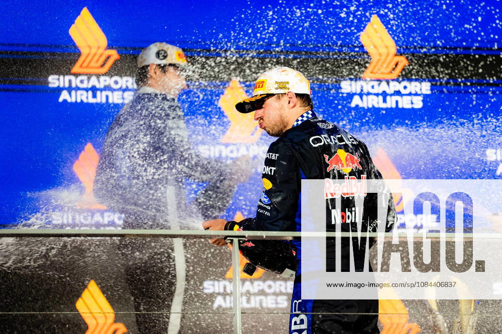 2026 Formula 1 Singapore Grand Prix - Podium CHARLES LECLERC 16 (MON) of Scuderia Ferrari HP (Ferrari SF-26) and MAX VERSTAPPEN 1 (NED) of Oracle Red Bull Racing (Red Bull Racing RB22) champagne celebration on the podium on Sunday Race Day during the Formula 1 Singapore Airlines Singapore Grand Prix 2026 at Marina Bay Street Circuit, Singapore, on October 11, 2026. Photo by Antoine Lapeyre Reveries Agency via ABACAPRESS.COM Singapore Singapore