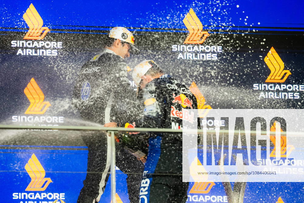 2026 Formula 1 Singapore Grand Prix - Podium CHARLES LECLERC 16 (MON) of Scuderia Ferrari HP (Ferrari SF-26) and MAX VERSTAPPEN 1 (NED) of Oracle Red Bull Racing (Red Bull Racing RB22) champagne celebration on the podium on Sunday Race Day during the Formula 1 Singapore Airlines Singapore Grand Prix 2026 at Marina Bay Street Circuit, Singapore, on October 11, 2026. Photo by Antoine Lapeyre Reveries Agency via ABACAPRESS.COM Singapore Singapore