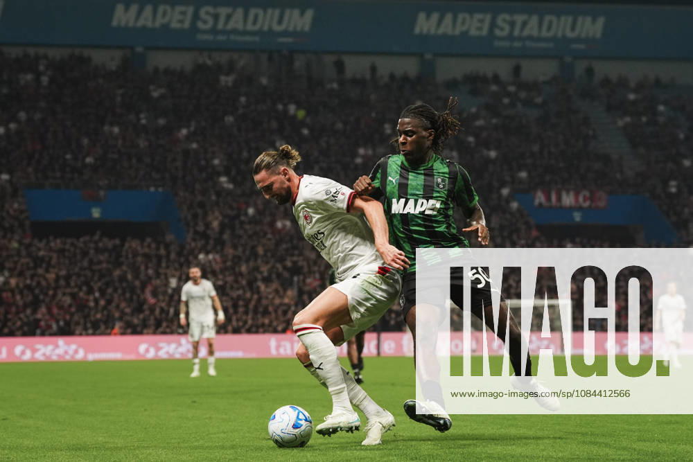 Milan s Adrien Rabiot fights for the ball with Sassuolos Darryl Bakola during the Serie A soccer match between Sassuolo and Milan at the Mapei Stadium in Reggio Emilia, north Italy - Sunday, October 11, 2026 -