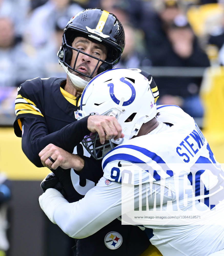 Pittsburgh Steelers quarterback Aaron Rodgers (8) is hit hard by Indianapolis Colts defensive tackle Grover Stewart (90) after throwing to Pittsburgh Steelers running back Jaylen Warren that makes the catch and runs 80 yards for a touchdown in the first quarter at Acrisure Stadium on Sunday, October 11, 2026 in Pittsburgh. PIT2026101102 ARCHIExCARPENTER