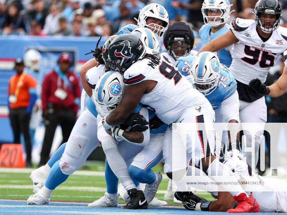Oct 11, 2026; Nashville, TN, USA; Tennessee Titans running back Tony Pollard (20) is tackled for a loss of yards during the NFL, American Football Herren, USA regular season game between the Houston Texans and Tennessee Titans at Nissan Stadium. Mandatory Credit: -Cal Media NFL 2026: Texans Vs Titans OCT 11 - ZUMAc04_ 20261011_zma_c04_072