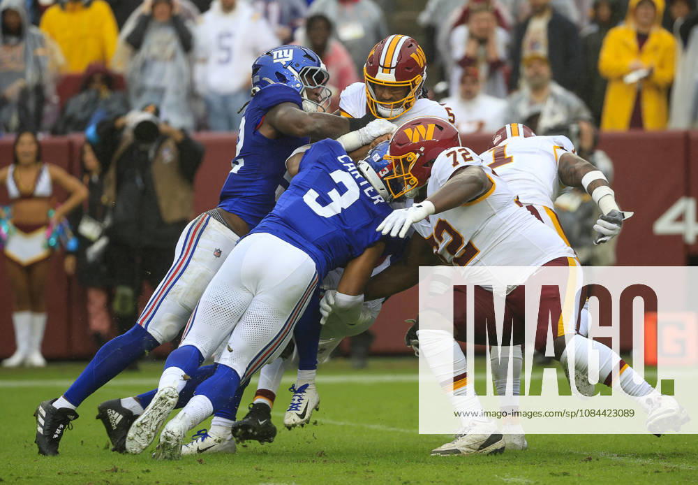 Washington Commanders QB 5 Jayden Daniels is sacked by New York Giants DB 22 Andru Phillips and New York Giants LB 3 Abdul Carter during the Washington Commanders game against the New York Giants at Northwest Stadium in Landover, MD. CSM Landover United States of America - ZUMAc04_ 20261011_zma_c04_060