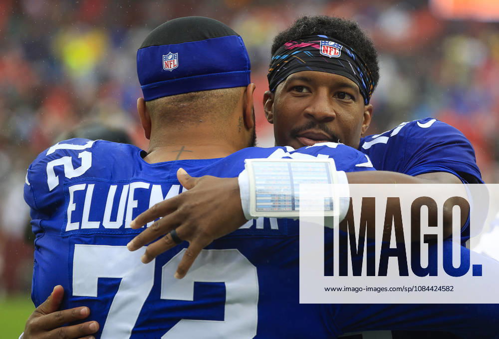 New York Giants QB 19 Jameis Winston hugs New York Giants G 72 Jermaine Eluemunor before the Washington Commanders game against the New York Giants at Northwest Stadium in Landover, MD. CSM NFL, American Football Herren, USA 2026: Washington Commanders Vs New York Giants OCT 11 - ZUMAc04_ 20261011_zma_c04_127