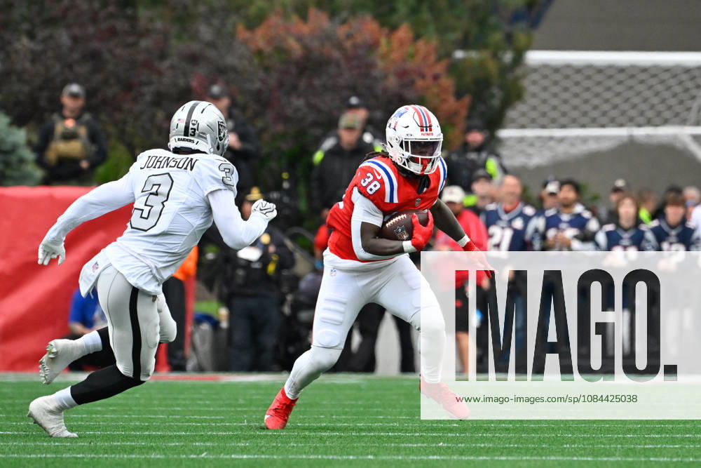 Oct 11, 2026; Foxborough, MA, USA; New England Patriots running back Rhamondre Stevenson (38) runs the ball against Las Vegas Raiders cornerback Taron Johnson (3) during the first half at Gillette Stadium. Mandatory Credit: -Cal Media NFL, American Football Herren, USA 2026: Raiders Vs Patriots OCT 11 - ZUMAc04_ 20261011_zma_c04_136