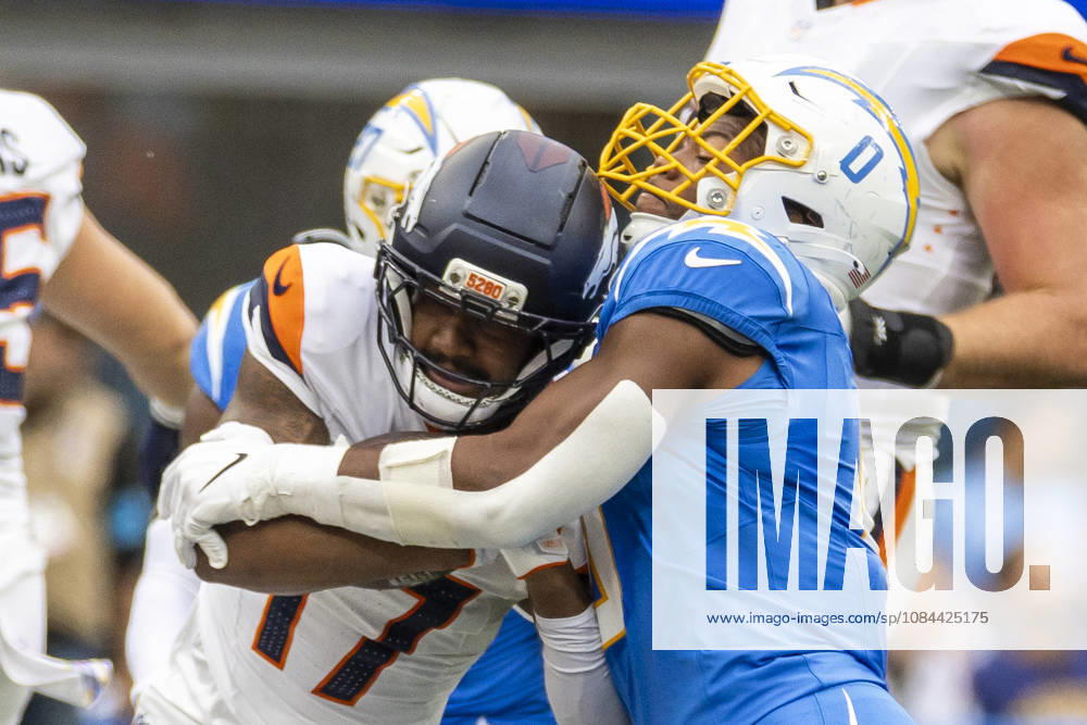 Denver Broncos Wide Receiver Jaylen Waddle (17) is stopped by Los Angeles Chargers linebacker Daiyan Henley (0) during an NFL, American Football Herren, USA football game, in Inglewood, Calif. on Sunday Oct. 11, 2026. Inglewood USA - ZUMAc68_ 20261011_zaf_c68_012