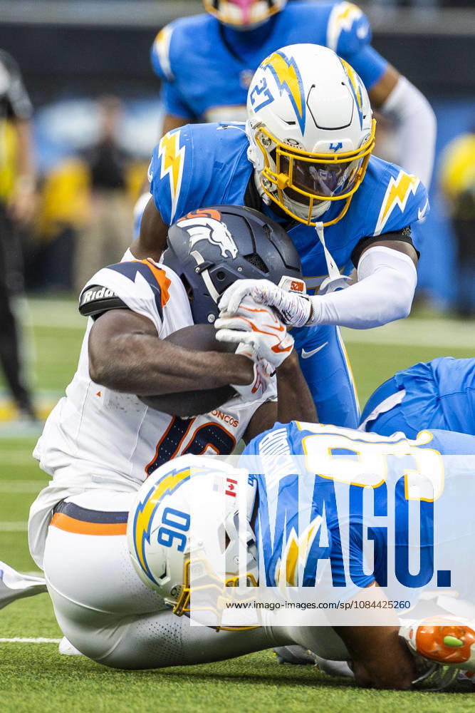 Denver Broncos Wide Receiver Marvin Mims Jr. (19) is brought down by Los Angeles Chargers defensive lineman Nick Barrett (91) and safety RJ Mickens (27) during an NFL, American Football Herren, USA football game, in Inglewood, Calif. on Sunday Oct. 11, 2026. Inglewood USA - ZUMAc68_ 20261011_zaf_c68_007