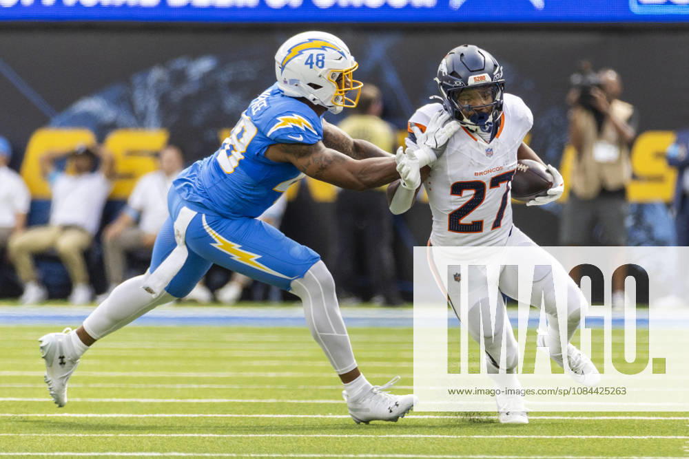 Denver Broncos Running Back J.K. Dobbins (27) escapes a tackle-attempt by Los Angeles Chargers outside linebacker Bud Dupree (48) during an NFL, American Football Herren, USA football game, in Inglewood, Calif. on Sunday Oct. 11, 2026. Inglewood USA - ZUMAc68_ 20261011_zaf_c68_008