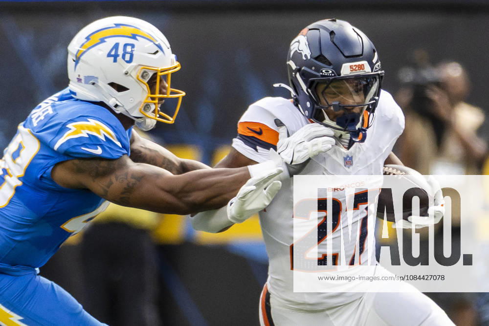 Denver Broncos Running Back J.K. Dobbins (27) escapes a tackle-attempt by Los Angeles Chargers outside linebacker Bud Dupree (48) during an NFL, American Football Herren, USA football game, in Inglewood, Calif. on Sunday Oct. 11, 2026. Inglewood USA - ZUMAc68_ 20261011_zaf_c68_003
