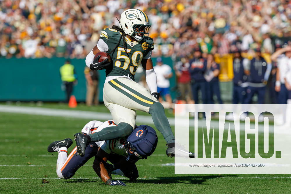 Oct 11, 2026; Green Bay, WI, USA; Green Bay Packers linebacker Ty ron Hopper (59) is tackled after making a interception during NFL, American Football Herren, USA game action against the Chicago Bears at Lambeau Field. Mandatory Credit: -Cal Media NFL 2026: Bears Vs Packers OCT 11 - ZUMAc04_ 20261011_zma_c04_231