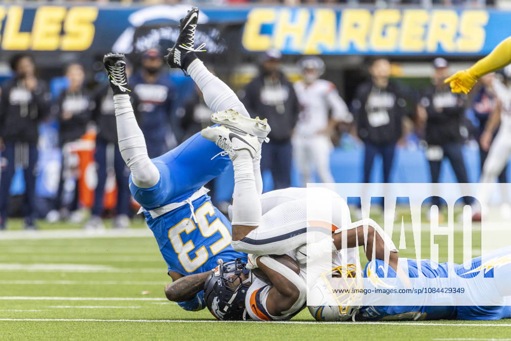 Denver Broncos Running Back J.K. Dobbins (27) is brought down by Los Angeles Chargers linebacker sDel Shawn Phillips (53) and Daiyan Henley (0) during an NFL, American Football Herren, USA football game, in Inglewood, Calif. on Sunday Oct. 11, 2026. Inglewood USA - ZUMAc68_ 20261011_zaf_c68_027