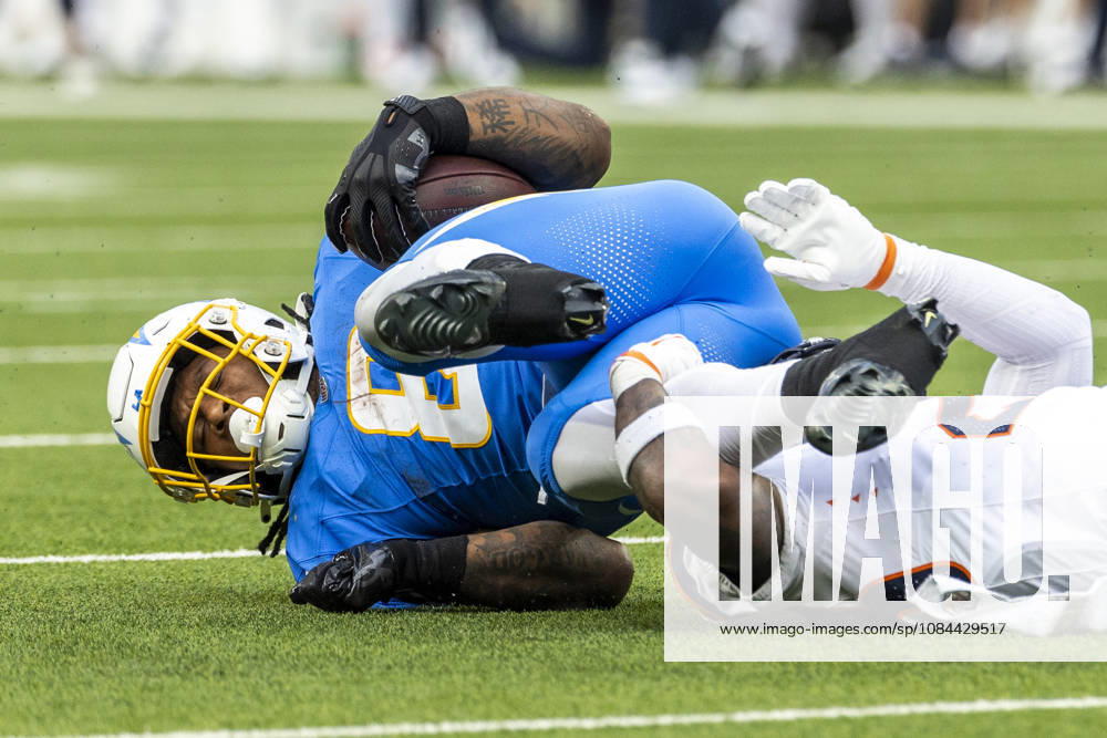 Los Angeles Chargers running back Omarion Hampton (8) its brought down by Denver Broncos Cornerback Jahdae Barron (23) during an NFL, American Football Herren, USA football game, in Inglewood, Calif. on Sunday Oct. 11, 2026. NHL, Eishockey Herren, USA 2026: Denver Broncos 23:17 LA Chargers - ZUMAc68_ 20261011_zaf_c68_024