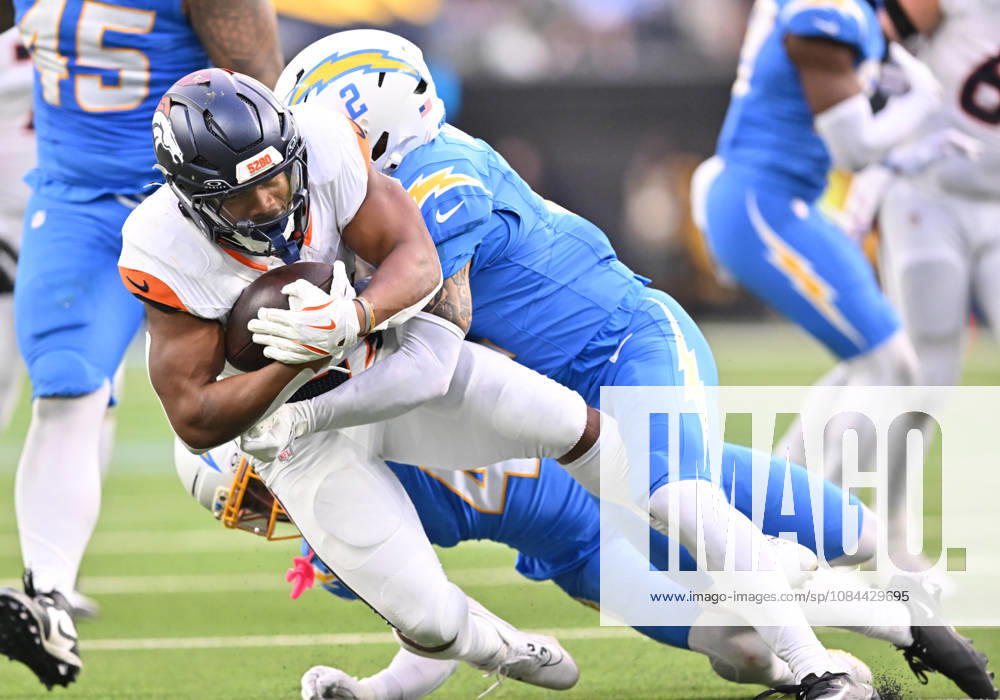 INGLEWOOD, CA - OCTOBER 11: Los Angeles Chargers cornerback Elijah Molden (2) tackles Denver Broncos running back J.K. Dobbins (27) after a gain during the game between the Los Angeles Chargers and the Denver Broncos on October 11, 2026 at SoFi Stadium in Inglewood. (Photo by David Dennis Icon Sportswire) NFL, American Football Herren, USA OCT 11 Broncos at Chargers Icon26101137