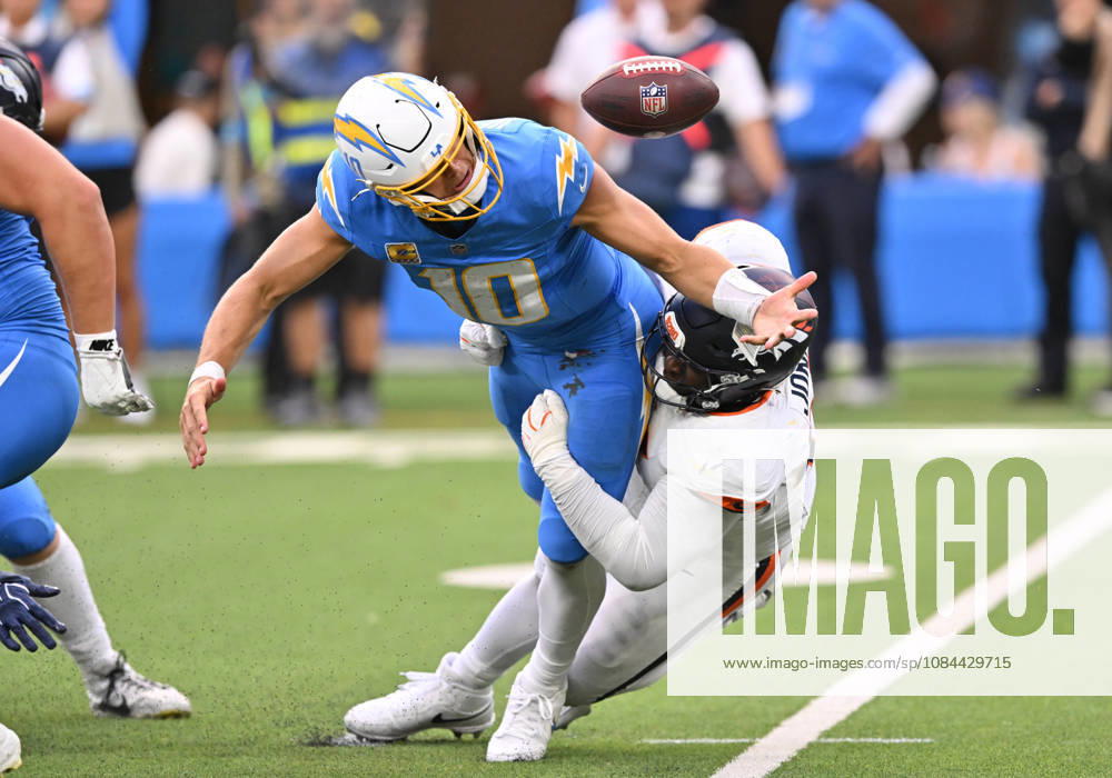 INGLEWOOD, CA - OCTOBER 11: Denver Broncos defensive tackle D.J. Jones (93) tackles Los Angeles Chargers quarterback Justin Herbert (10) while knocking the ball loose during the game between the Los Angeles Chargers and the Denver Broncos on October 11, 2026 at SoFi Stadium in Inglewood. (Photo by David Dennis Icon Sportswire) NFL, American Football Herren, USA OCT 11 Broncos at Chargers Icon26101146